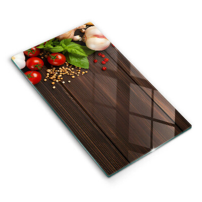 Üveg vágódeszka fényképpel Zöldségek az asztalon