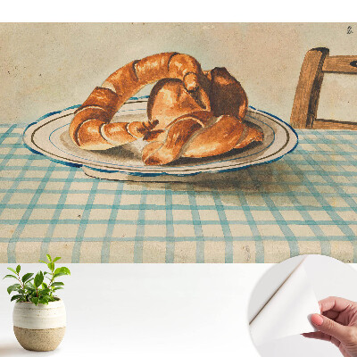 Tapéta croissantokkal egy tányéron, kockás asztal mintájával