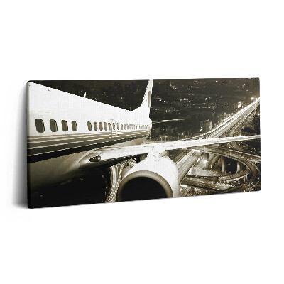 Vászonfotó 100x50 Repülőgép és város