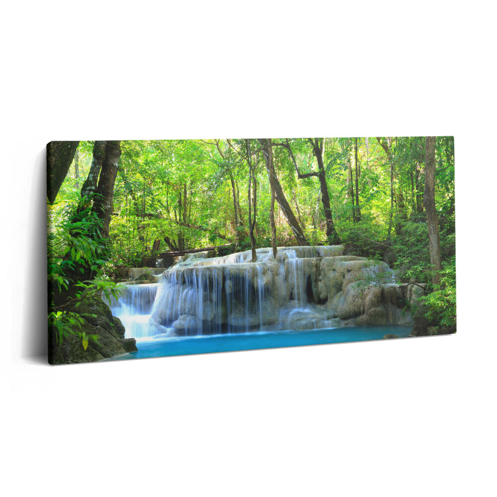 Vászonfotó 100x50 Tájkép egy vízesésről egy erdőben