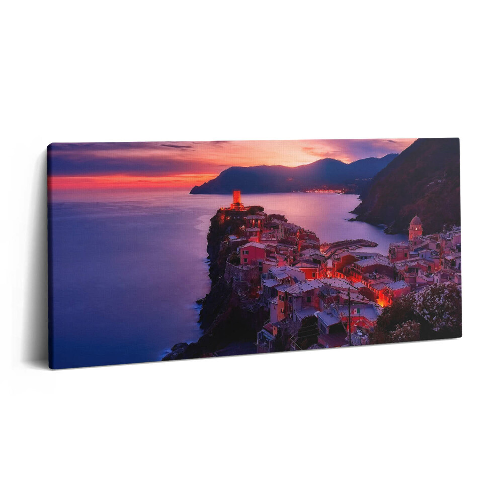 Vászonfotó 100x50 Tengerparti város este