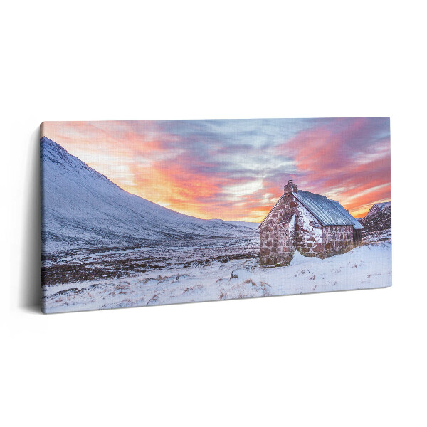 Vászonfotó 100x50 Házikó a havas hegyekben