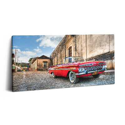 Vászonfotó 100x50 Régi piros autó a kolumbiai negyedben