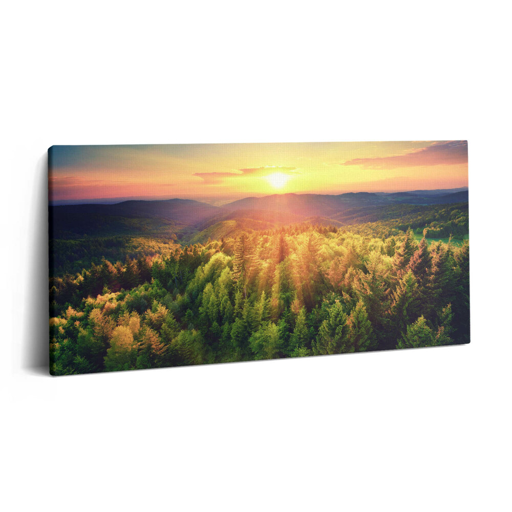 Vászonkép nyomtatás 120x60 Naplemente erdős hegyek felett