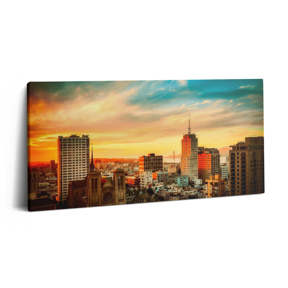 Vászonkép 140x70 A város panorámája napfelkeltekor