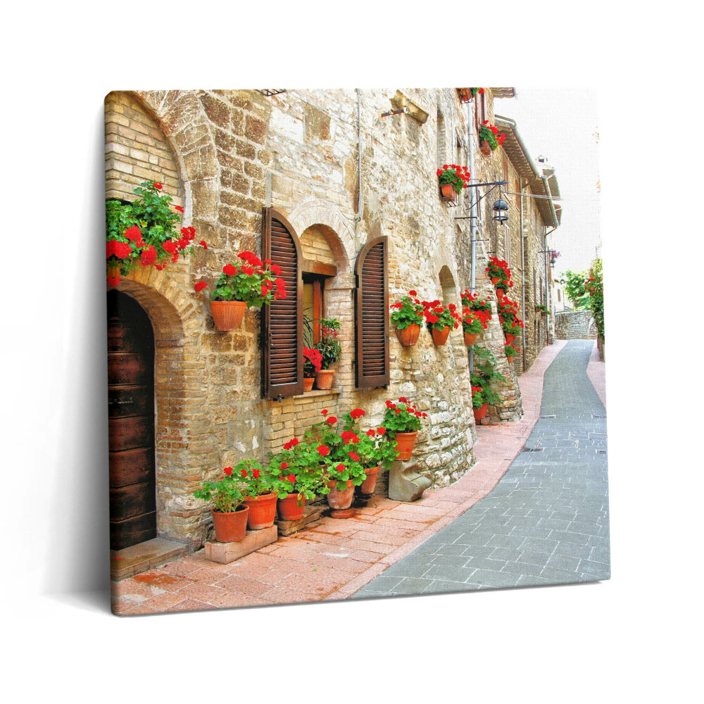 Vászonkép 60x60 Festői utca virágokkal