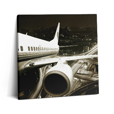 Vászonkép 60x60 Repülőgép és város