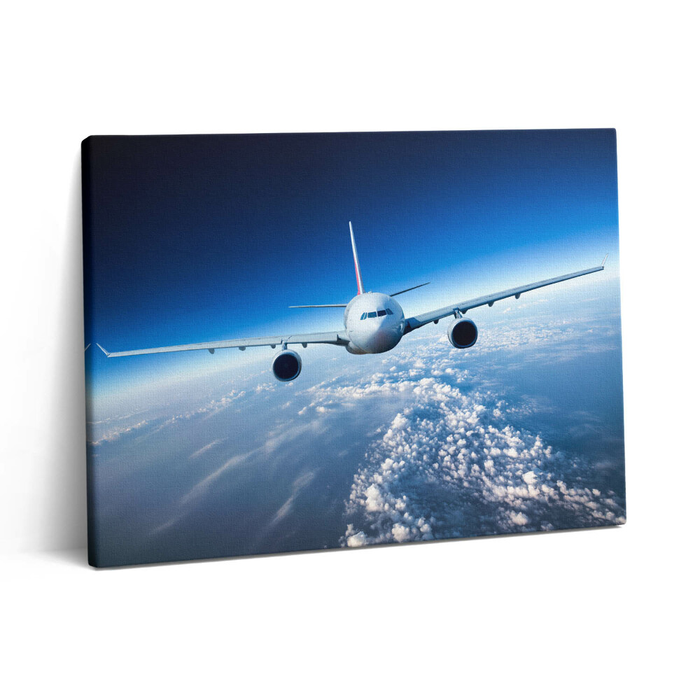 Vászonkép falra 80x60 Repülőgép a felhők felett