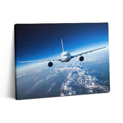 Vászonkép falra 80x60 Repülőgép a felhők felett