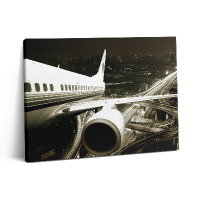 Vászonkép falra 80x60 Repülőgép és város