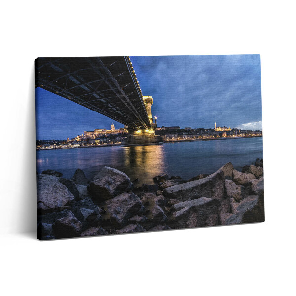 Vászonkép falra 80x60 Sziklás part egy híd alatt