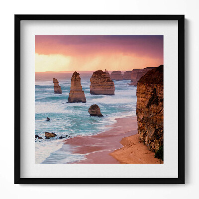 Keretezett falikép Tengerparti sziklaformációk naplementében