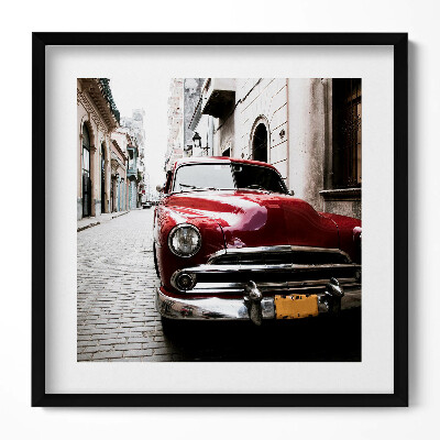 Keretezett falikép Régi piros autó egy keskeny utcában