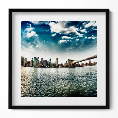 Keretezett falikép Városi táj vízpart felhős ég