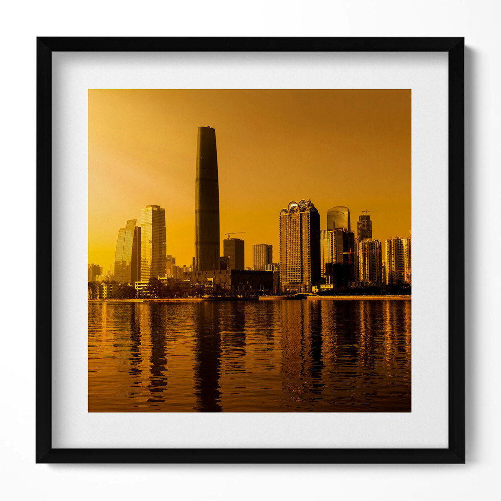 Keretezett falikép Modern városkép naplementében