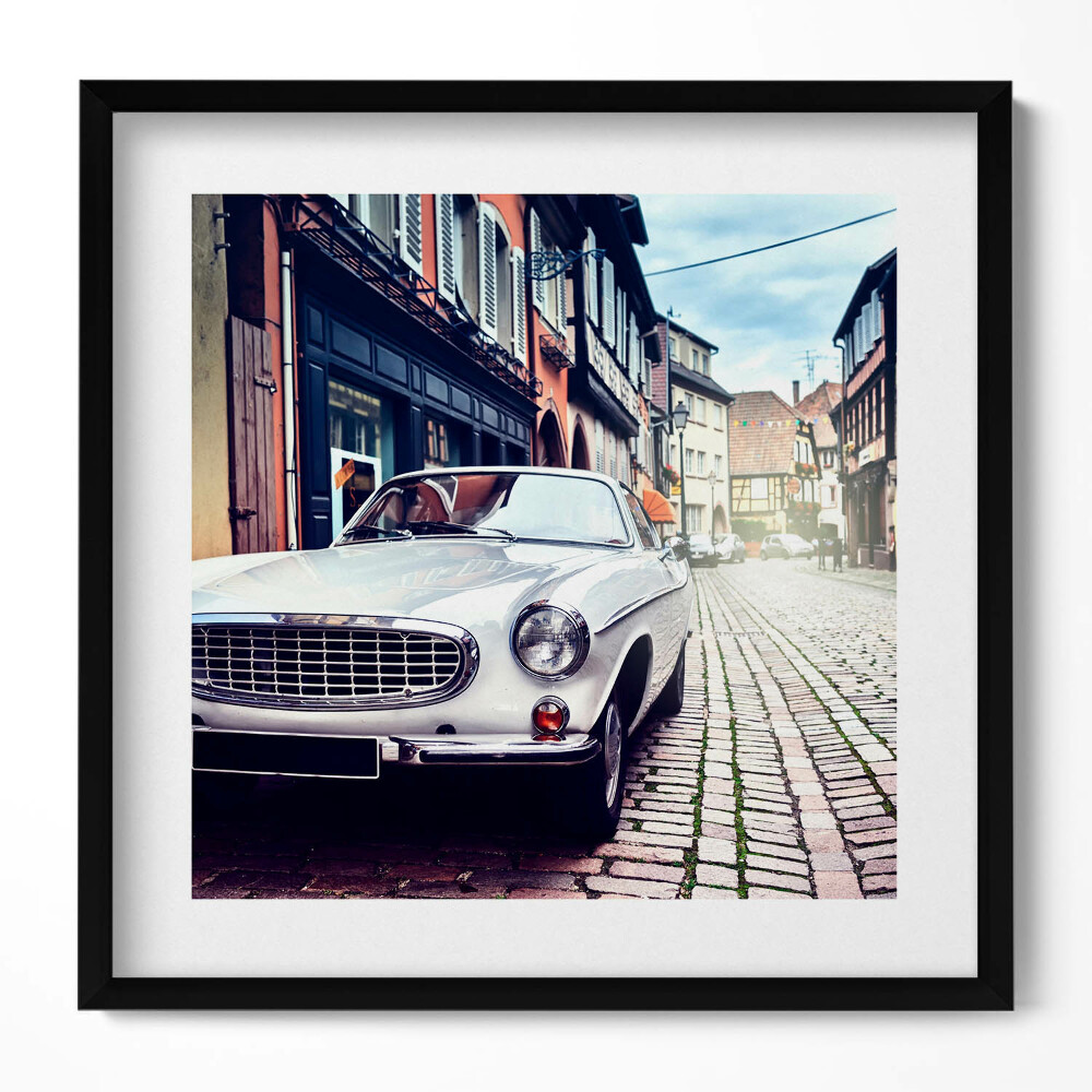 Keretezett falikép Fehér klasszikus autó városi utca