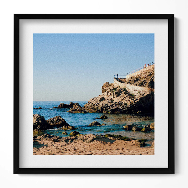 Keretezett falikép Tengerparti sziklákkal és kék vízzel