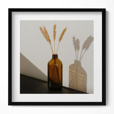 Keretezett falikép Barna üveg vázában búzavirágok