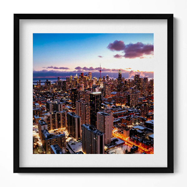 Keretezett falikép Városi táj naplementében