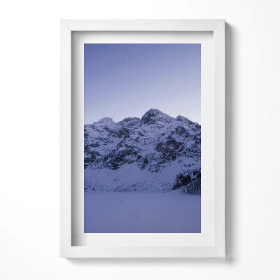 Keretezett kép Havas hegycsúcsok és kék ég