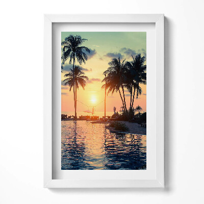 Keretezett kép Naplemente pálmafákkal és vízparttal