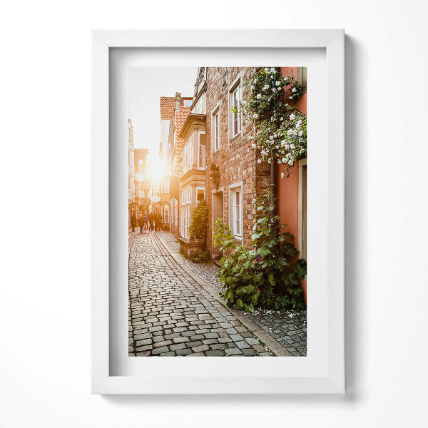 Keretezett kép Kanyargós utca napfény régi házak