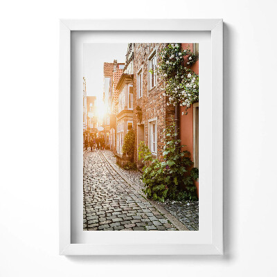 Keretezett kép Kanyargós utca napfény régi házak