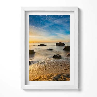 Keretezett kép Nyugodt tengerpart kövek és naplemente
