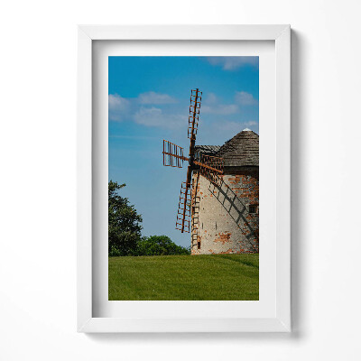 Keretezett kép Szélmalom zöld mezőn