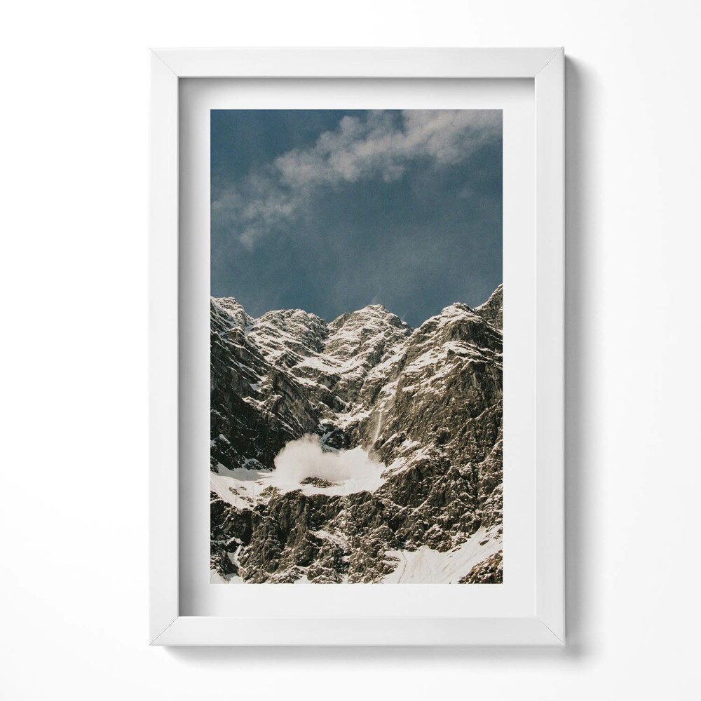 Keretezett kép Havas hegycsúcsok kék ég