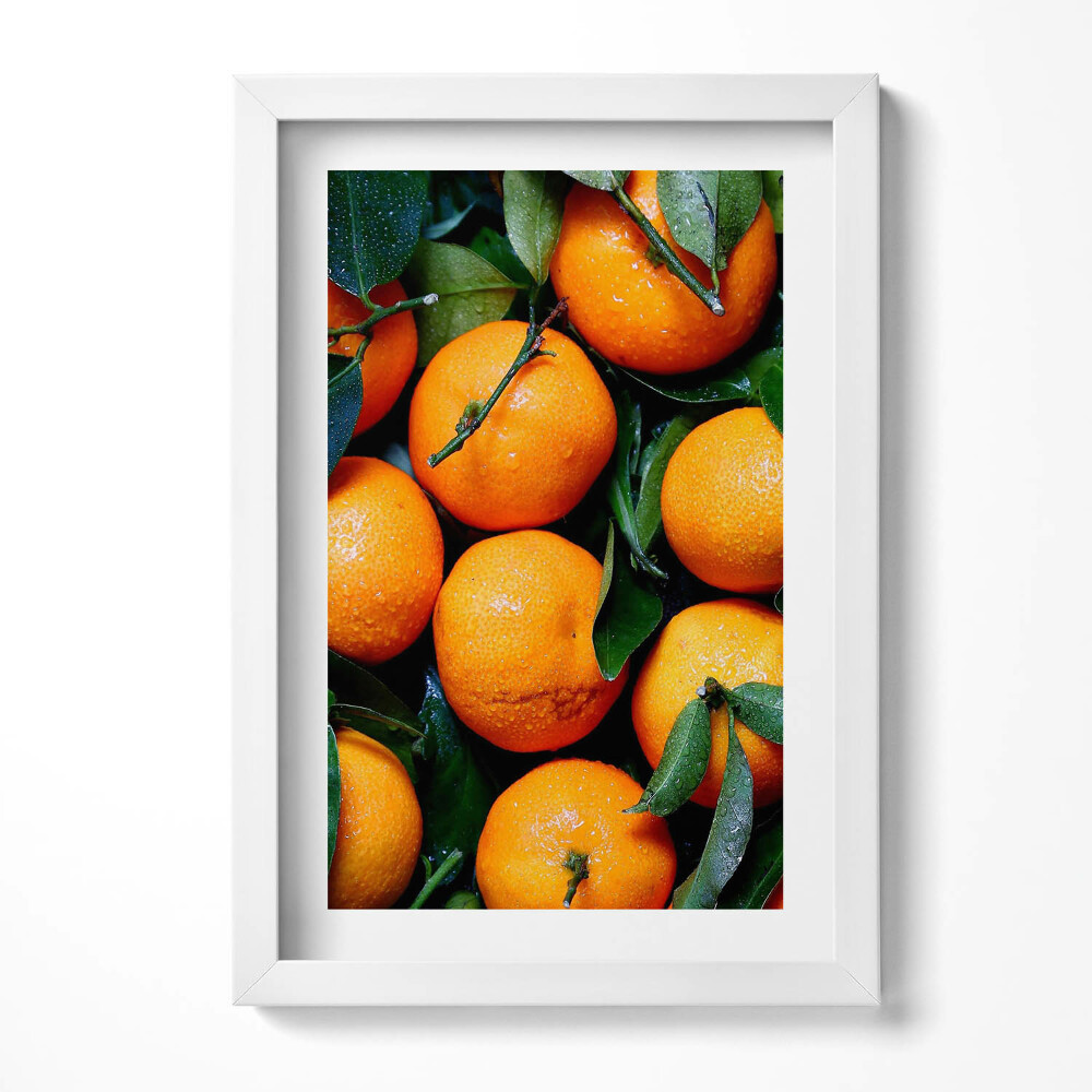 Keretezett kép Friss narancsok zöld levelekkel