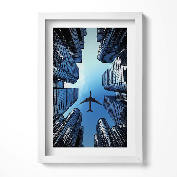 Keretezett kép Repülőgép városi felhőkarcolók között