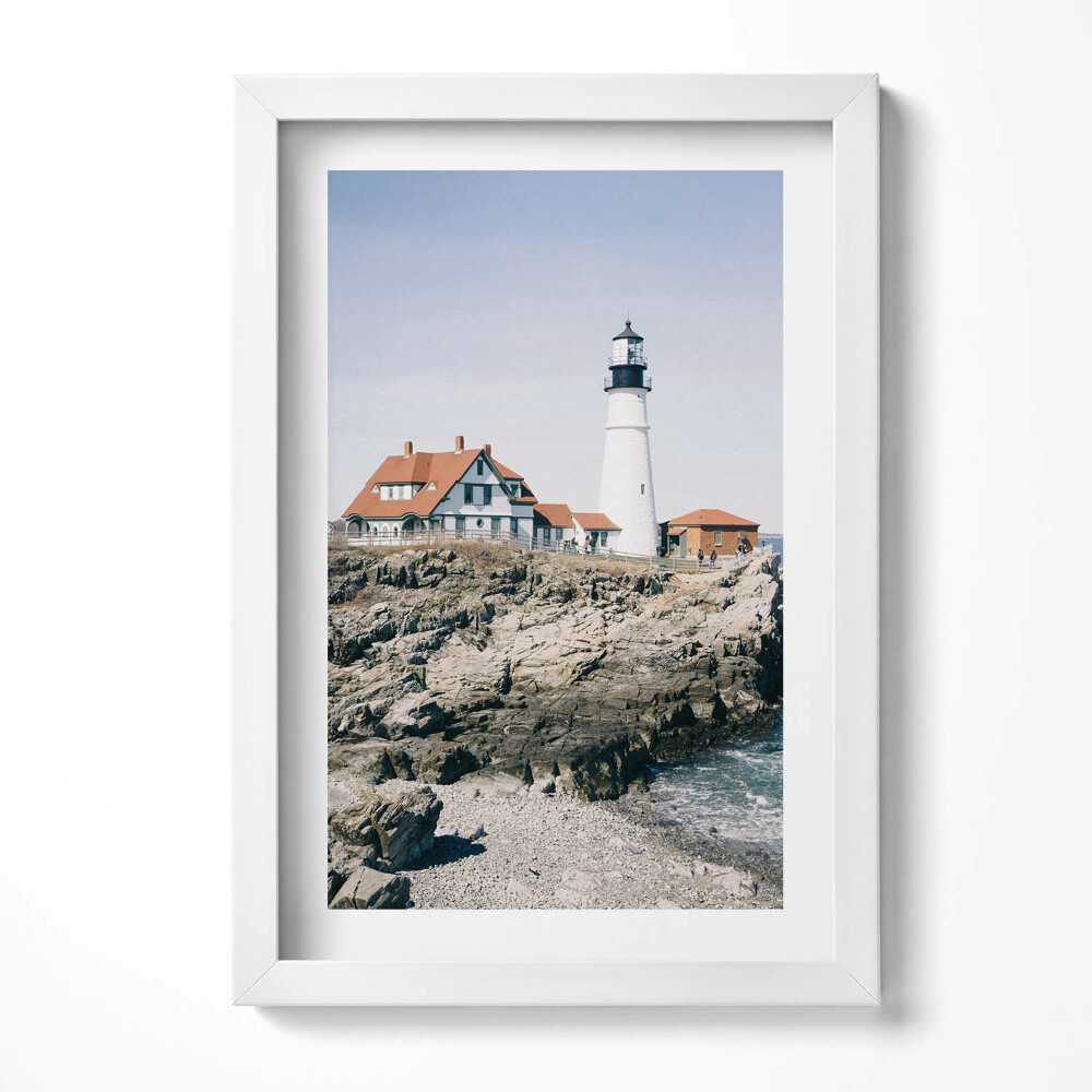 Keretezett kép Fénytorony tengerparti házakkal