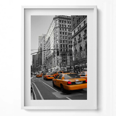 Függőleges kép keretben Sárga taxik városi utcán