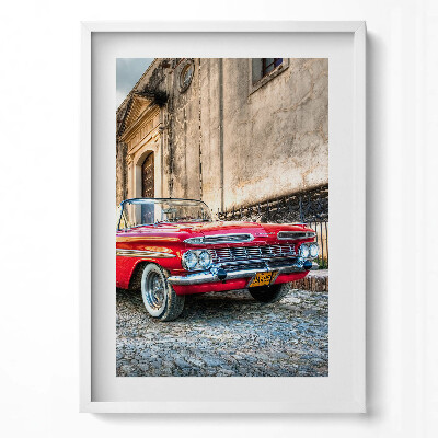 Függőleges kép keretben Piros klasszikus autó egy régi épület előtt