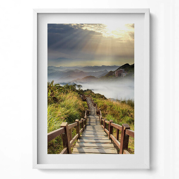 Függőleges kép keretben Fakorlátos lépcső egy hegyvidéki tájon