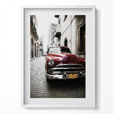 Függőleges kép keretben Régi piros autó egy keskeny utcában