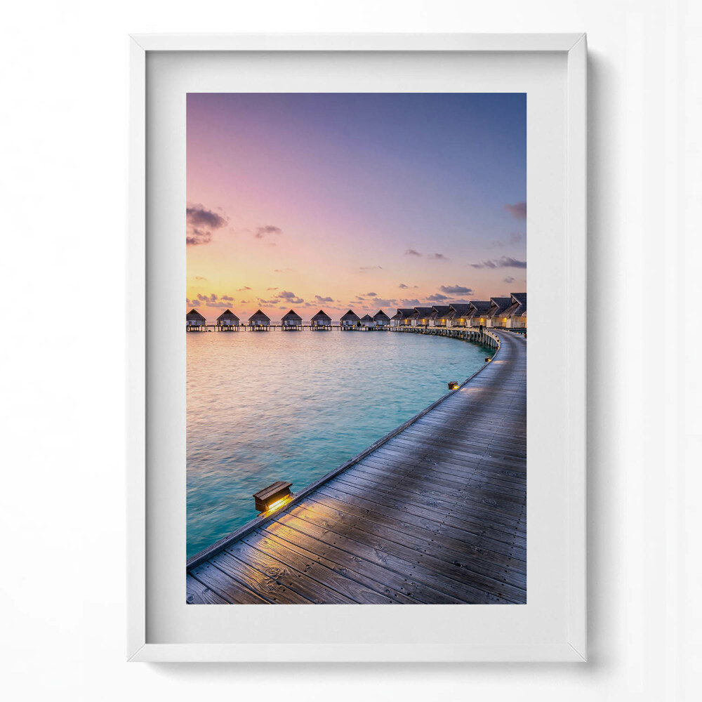 Függőleges kép keretben Tengerparti naplemente vízparti házak