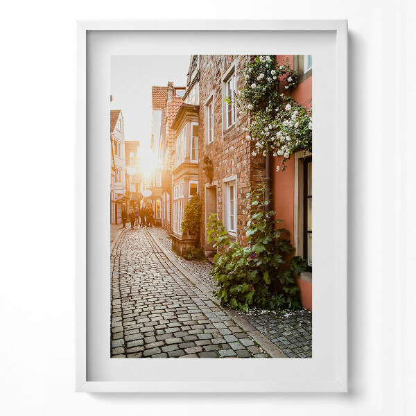 Függőleges kép keretben Kanyargós utca napfény régi házak