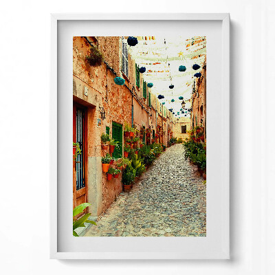 Függőleges kép keretben Színes virágos utcácska