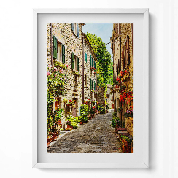 Függőleges kép keretben Szűk virágokkal díszített utcácska