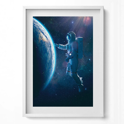 Függőleges kép keretben Űrhajós az űrben Föld felé nyúlva