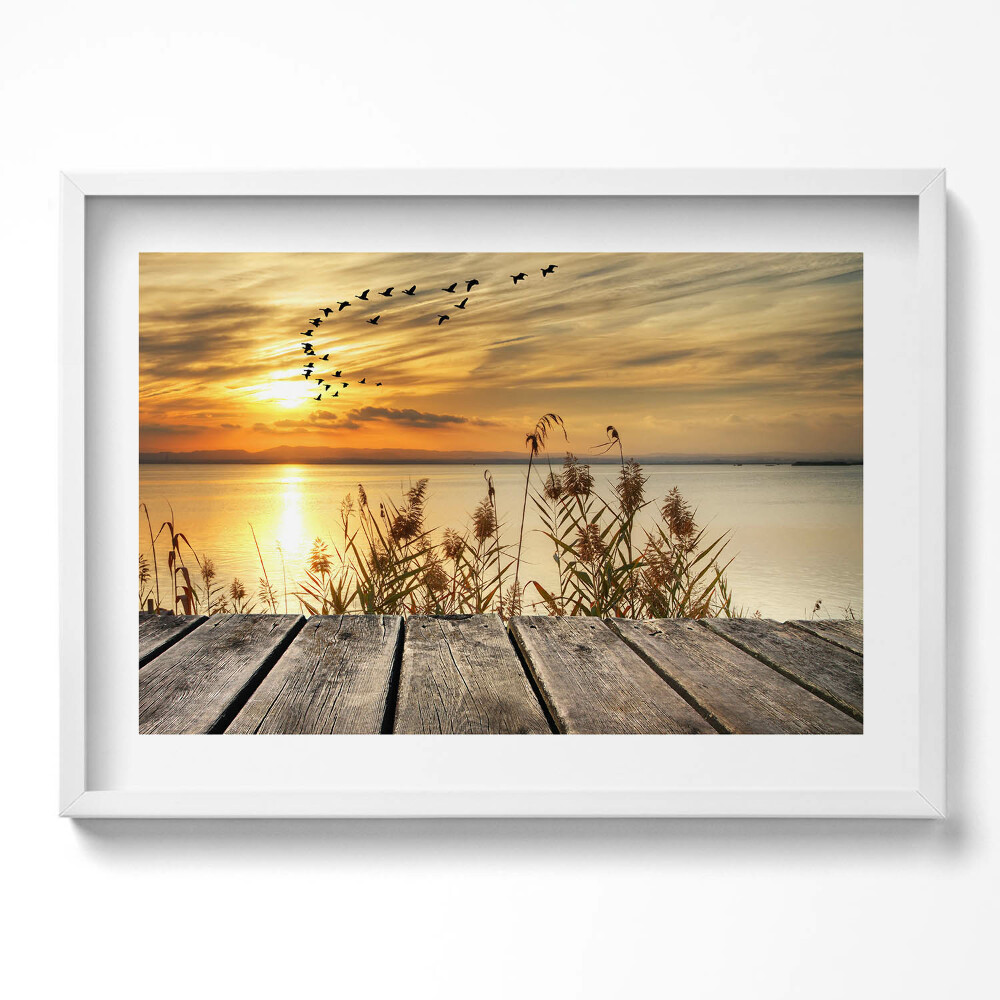 Kép keretben Naplemente vízparton madarak repülnek