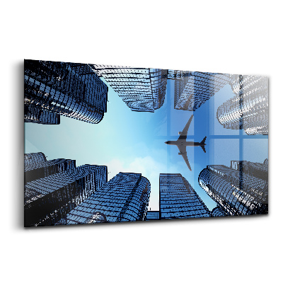 Üvegkép Repülőgép épületek felett